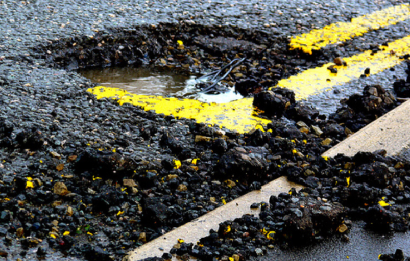 Image of large pothole on a road