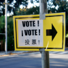 Vote sign with three languages