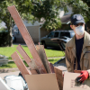 A volunteer clears debris after Harvey