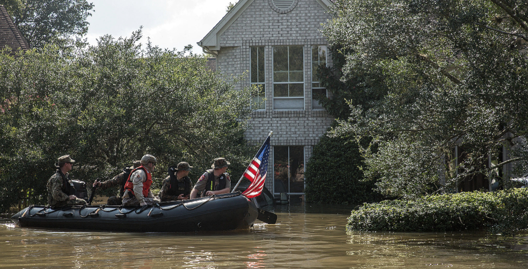 Rescue team at a flooded house during Hurricane Harvey