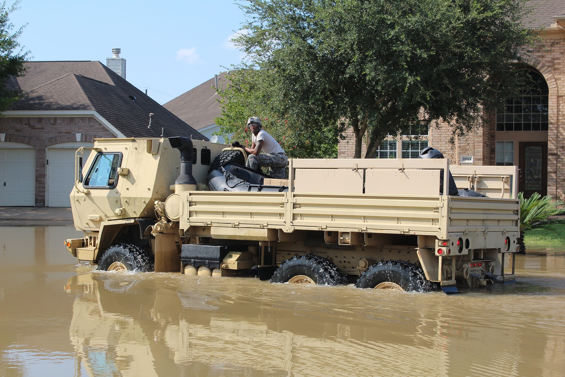 A vehicle makes its way through a neighborhood in the aftermath of Hurricane Harvey, which caused flooding in the region in August 2017.