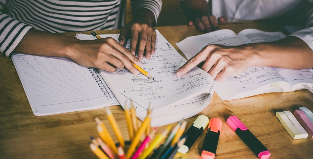 Students review coursework during a class session.