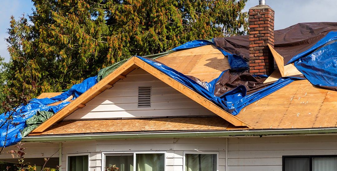 photo of a house undergoing roof repair