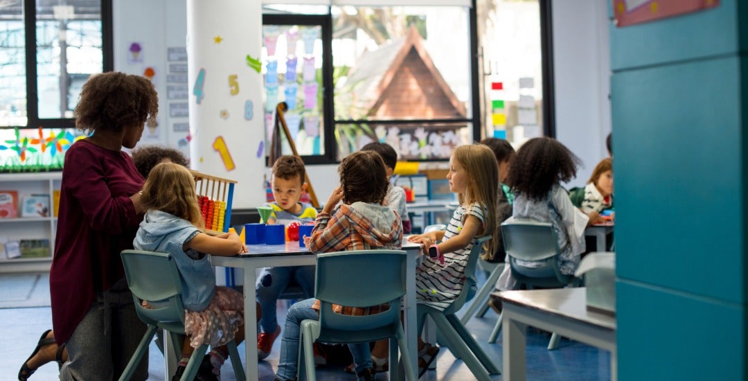 Elementary school students attend a class together.