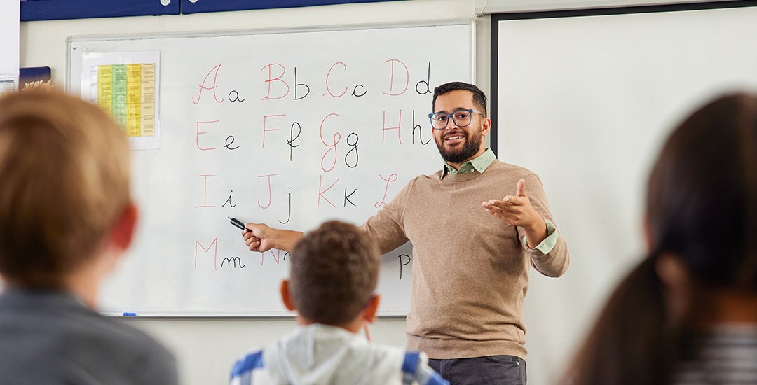 teacher in classroom teaching ABC