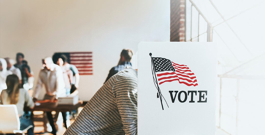 people at voting booths