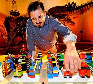 Image of James Rojas and a village built from Legos