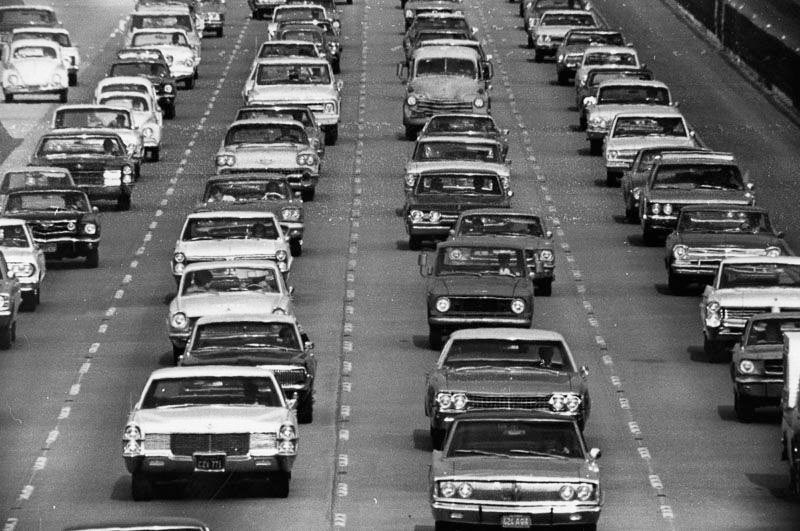 Vintage cars sitting in traffic