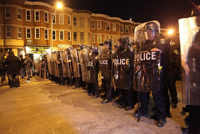 Police standing with shields 
