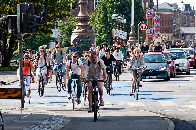 Copenhagen residents bicycle through the city. Image via flickr/Colville-Andersen.