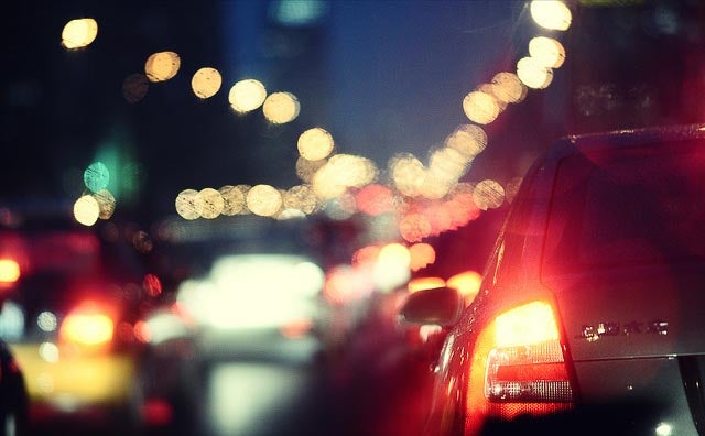 Car sitting in traffic at dusk