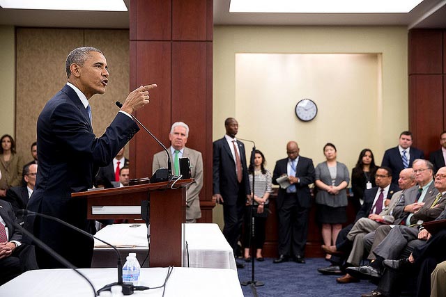 Former President Barack Obama speaking to a group of people