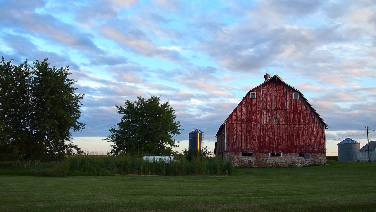 Red barn in a green field