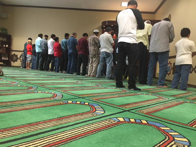 Men praying in the Mosque