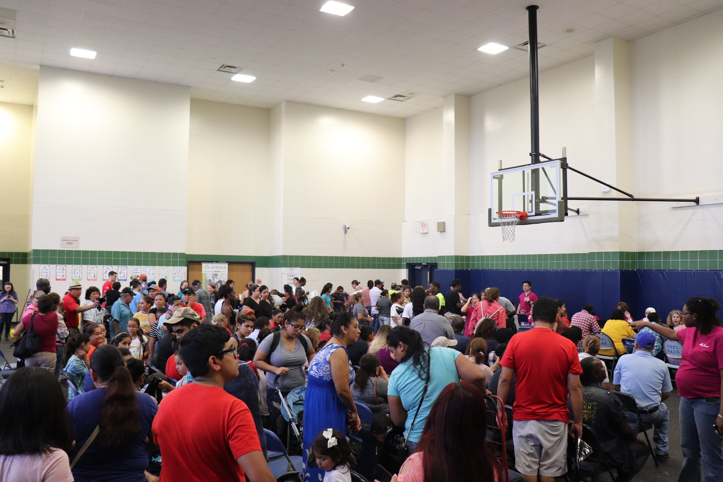 Crowds inside the recovery fair seek information and services