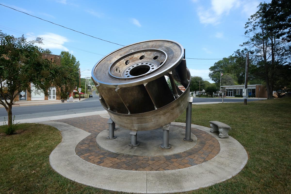 A turbine that once powered the aluminum plant is displayed in downtown Badin. Photo: Nancy Pierce