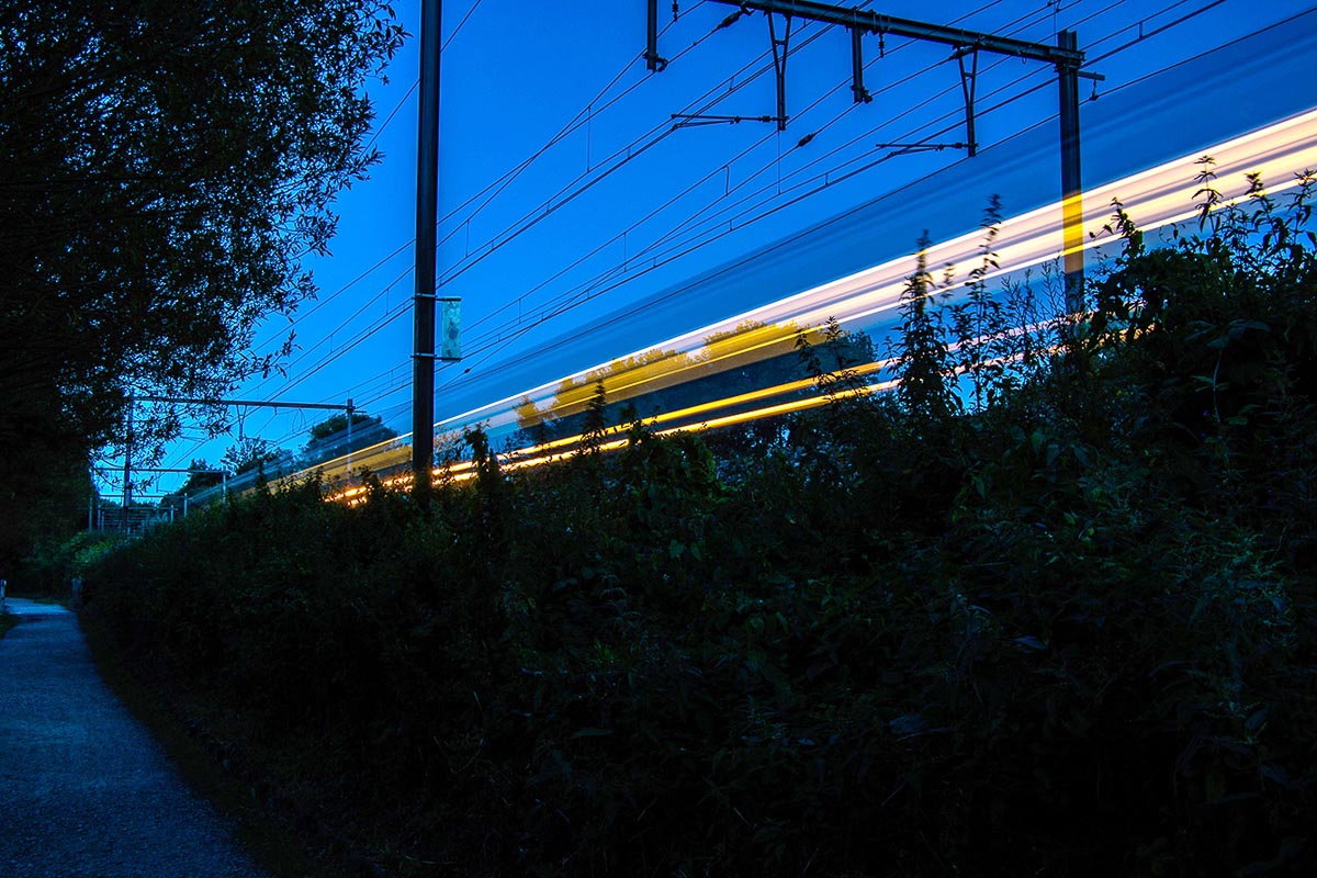 time lapse photo of light rail train