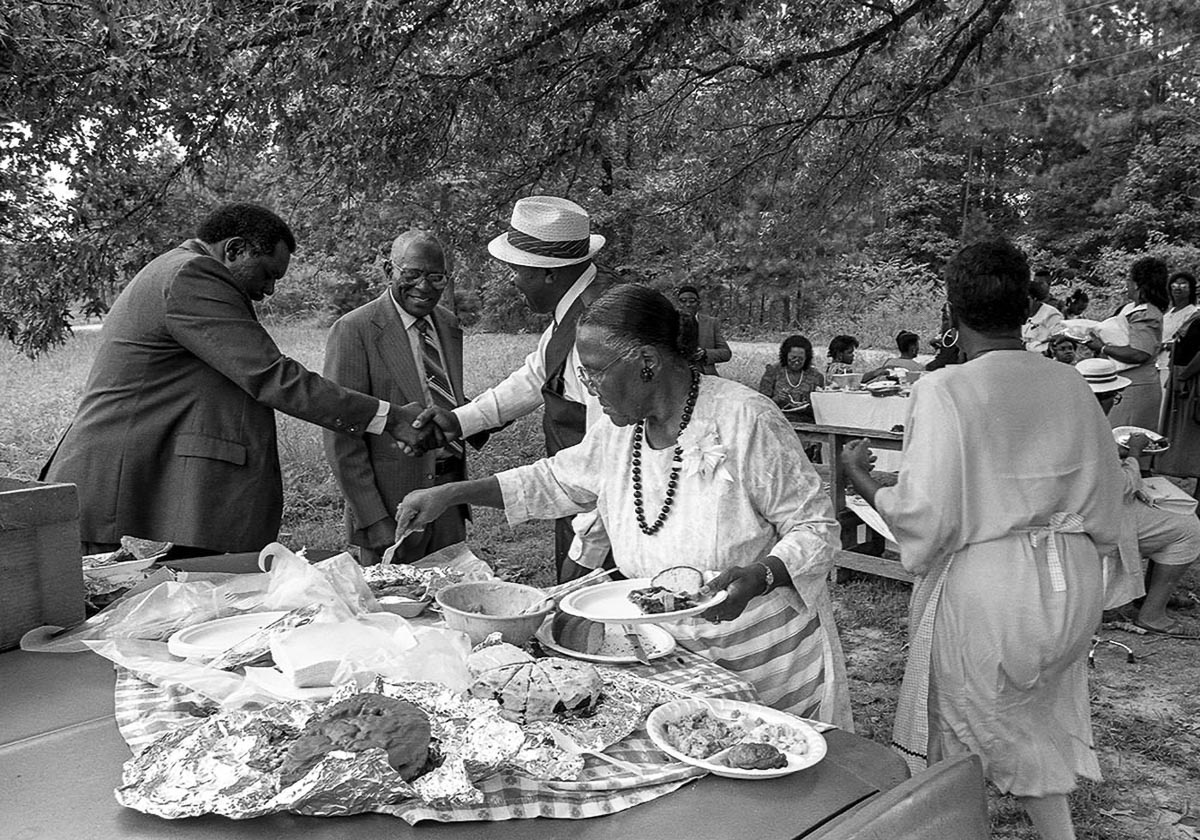 A local church hosts a picnic during County Line's 1991 homecoming. The three-day event, which still takes place today, honors the Texas freedom colony's history and residents — past, present, and future. Photo by Richard Orton.