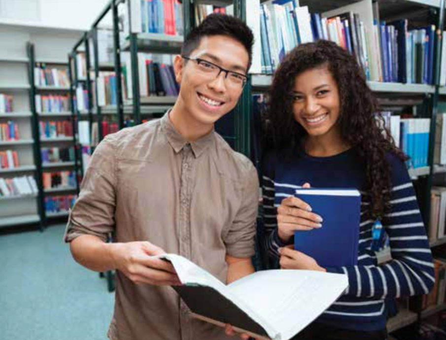 Image of two people in a library
