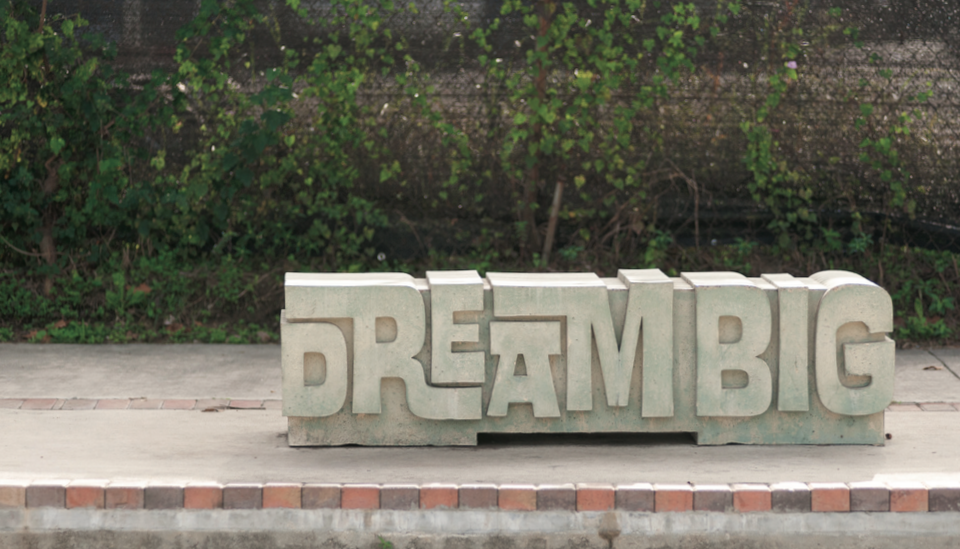 Image of bench in East End that says "Dream Big"