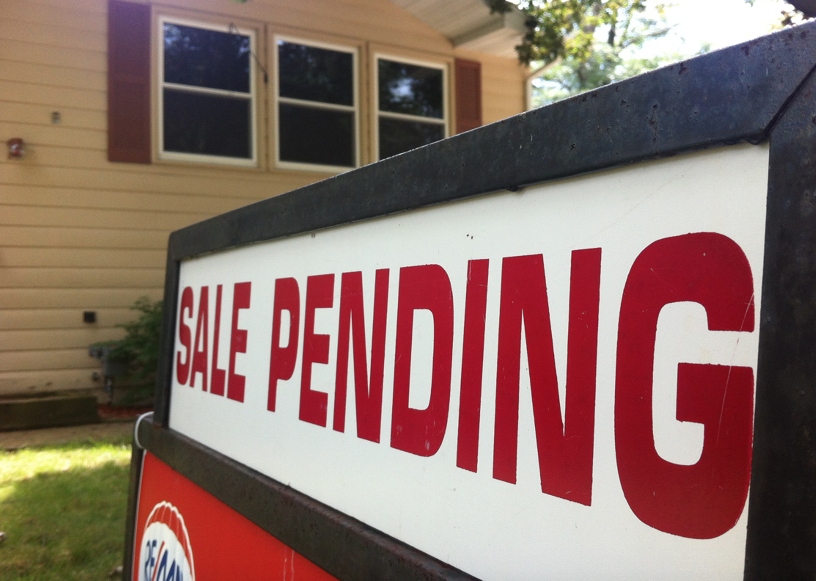 Sale Pending sign in front of home
