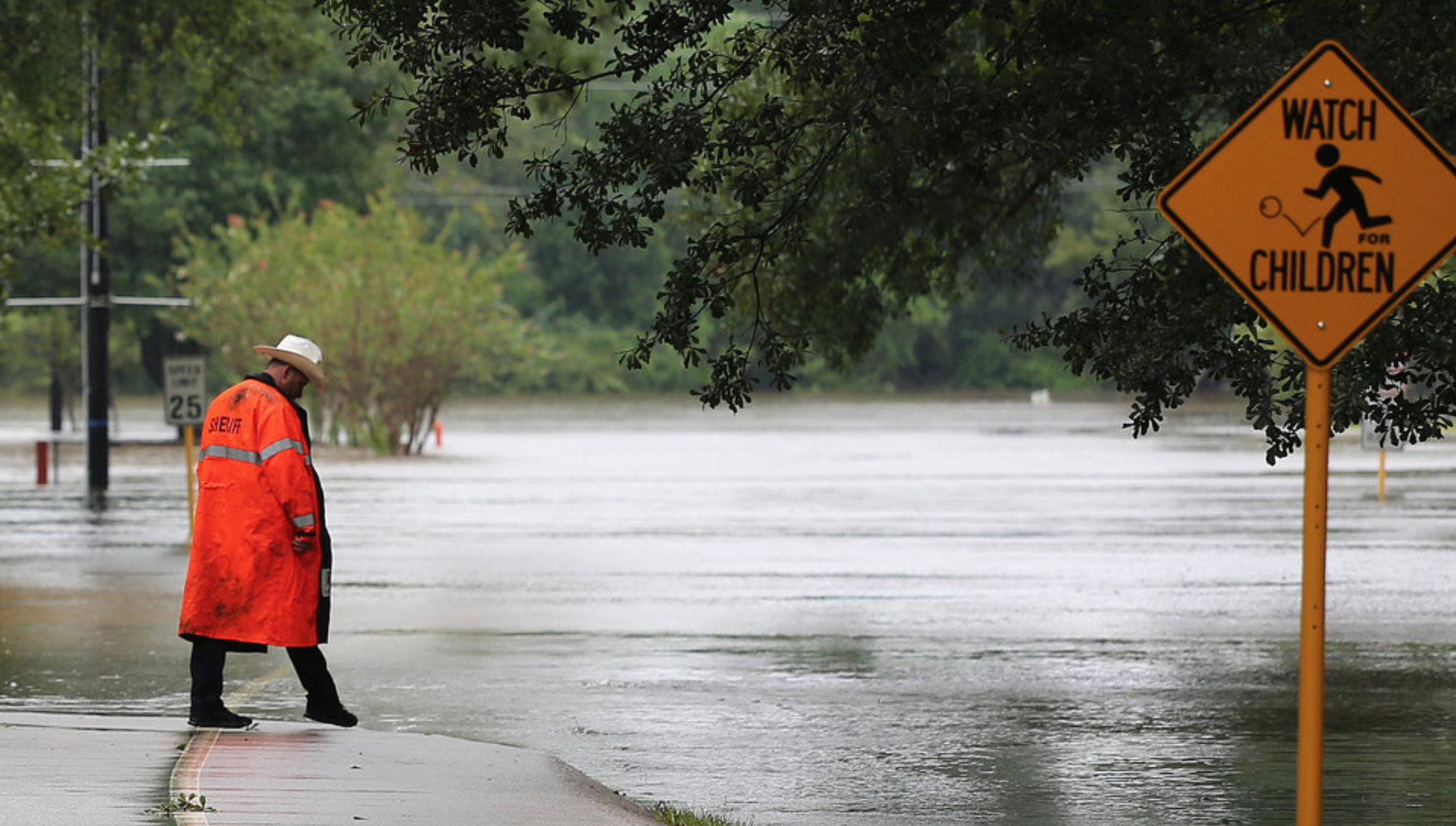 Sheriff officer checking out flood waters