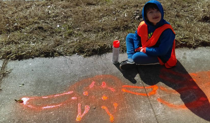 Kid on the sidewalk