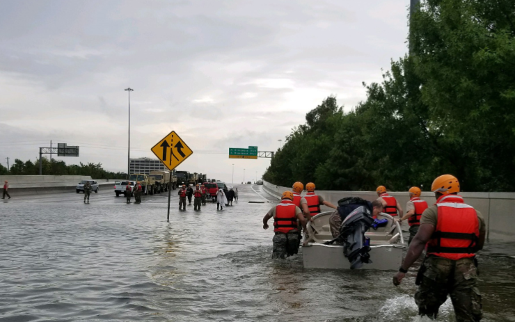 People wade through flood waters during Hurricane Harvey.