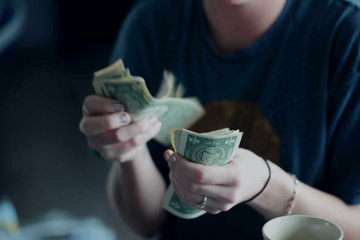 Woman counting money cash