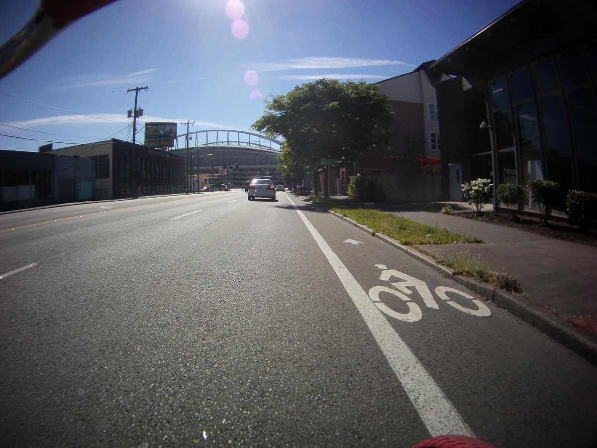Substandard bike lanes, like this one in Seattle, expose cyclists to unsafe passing by motorists and collisions with cars turning right at intersections or pulling out of driveways. Joshua Putnam, CC BY