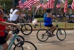 Families on bikes at a July Fourth parade in Houston's Northside neighborhood. Jimmy Castillo, CC BY-ND 