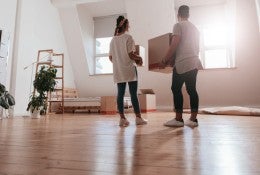 A young couple moves into a new home. 