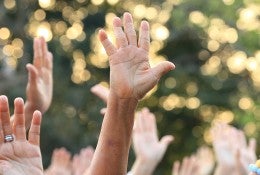 people participating by raising thier hands