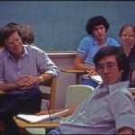 Dr. Stephen Klineberg sitting in class with students, Rice University