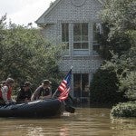 Rescue team at a flooded house during Hurricane Harvey
