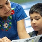 Teacher working with a student