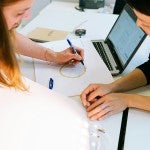 Two people working on project