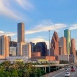 The Houston skyline reaches into the clouds.