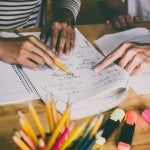 Students review coursework during a class session.