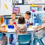 Pre-K classroom with teacher and students