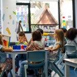 Elementary school students attend a class together.