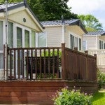 A neighborhood of manufactured homes along a street.