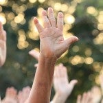 people participating by raising thier hands