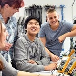 group of young students in vocational education and training for electronics 