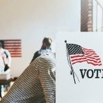 people at voting booths