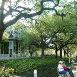 Image of people sitting on a bench at Discovery Green in Houston, Texas