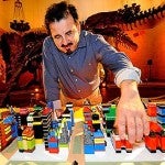 Image of James Rojas and a village built from Legos