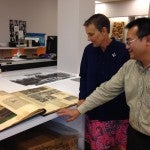 Two people looking at artifacts 