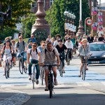 Copenhagen residents bicycle through the city. Image via flickr/Colville-Andersen.