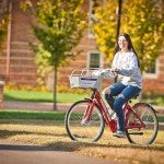 Woman on a bike share bike